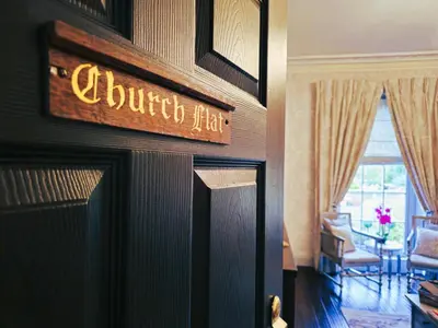 a hotel sign on the door of a hotel room at Beautifully decorated, elegant apartment near town - Pass the Keys in Shrewsbury