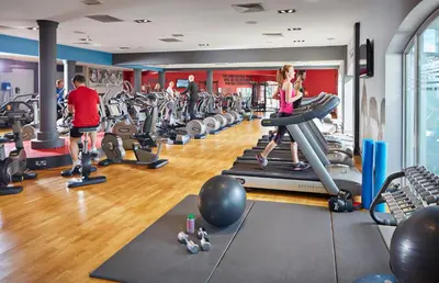 a group of people exercising in a gym at Lion Quays Resort in Oswestry