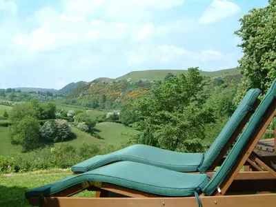 a lounge chair sitting on top of a hill at Pen-Y-Dyffryn Country Hotel in Oswestry