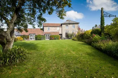a large lawn in front of a house at The Swan At Hay in Hay-on-Wye