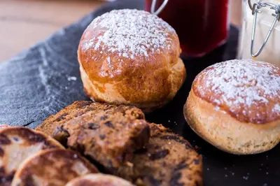 a group of donuts sitting on top of a table at The Swan At Hay in Hay-on-Wye