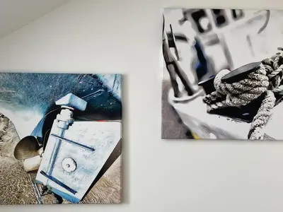 two pieces of art on a white wall at Seascape in New Quay