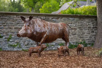 a statue of a cow and three baby animals at Mellington Hall Country House Hotel in Church Stoke
