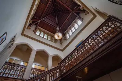 a building with a wooden staircase with a ceiling at Mellington Hall Country House Hotel in Church Stoke