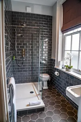 a bathroom with a shower and a tub and a toilet at Mytton and Mermaid - Brunning and Price in Shrewsbury