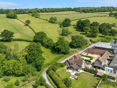 an aerial view of a house in a field at The Wain House in Acton Scott