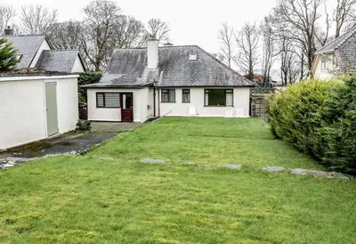 a white house with a yard in front of it at Brynteg in Llwyngwril