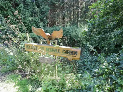 a sign with a bird sitting on top of it at Kite's Nest in Eaton