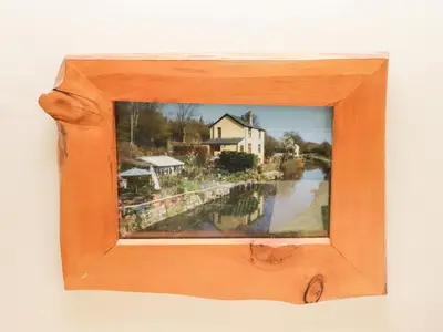 a picture of a painting of a house on a river at Beacons Rest in Llanspyddid