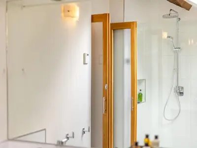a bathroom with a shower and a mirror at The Cider Mill in Kings Pyon