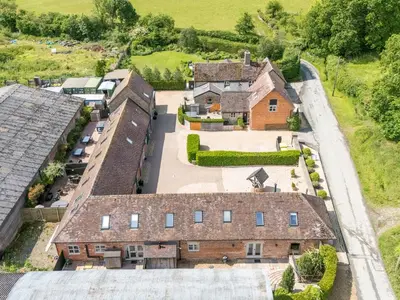 an aerial view of a house with a yard at The Turnip House in Acton Scott