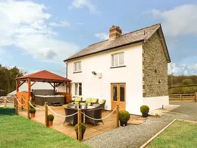 a house with a gazebo and a patio at Cwmcelyn in Nantmel
