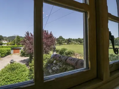 a view from a window of a yard at Lower Court Byre in Kinsham