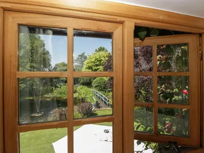 a view through a window of a garden at Lower Court Byre in Kinsham