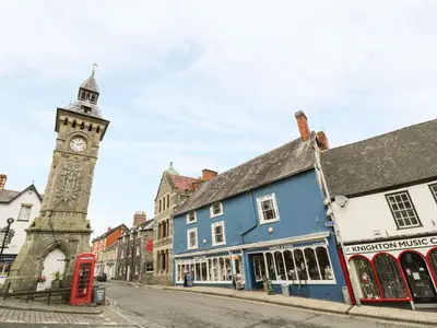 a clock tower in the middle of a street at Middle Hivron in Bleddfa