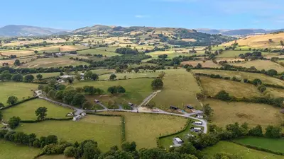 an aerial view of a farm in a field at Caban Nant Ddu in Nantmel