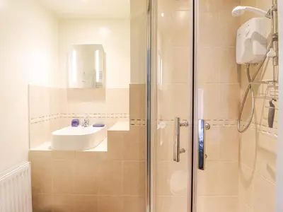 a bathroom with a sink and a shower at Bodywen in Llangynog