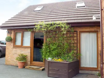 a house with a large planter in front of it at Penylodge in Builth Wells