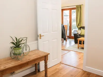 a room with a table and a plant on it at Clun Forest Cottage in Monkhopton