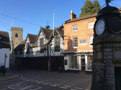 a clock tower on the side of a street at Ryelands Cottage in Easthope