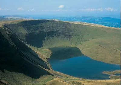 an aerial view of a lake on the side of a mountain at Flying Scotsman in Cray