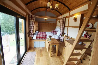 a room with a bed in a tiny house at Flying Scotsman in Cray