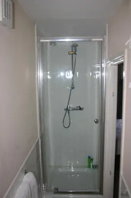 a shower in a bathroom with a glass shower stall at The Vaults in Shrewsbury