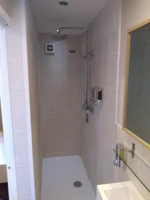 a bathroom with a shower and a sink at The Vaults in Shrewsbury