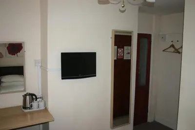 a room with a flat screen tv on a wall at The Vaults in Shrewsbury