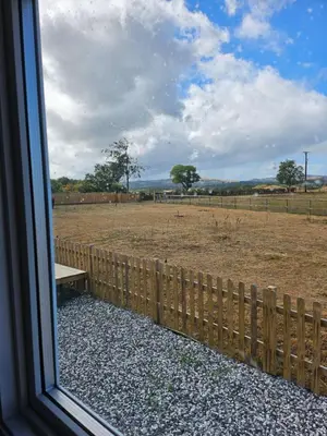 a window view of a fence and a field at Ruth's Repose Country Retreat with private hot tub & Stunning Views in Shrewsbury