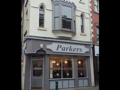a panthers store on a city street with a sign at Parkers House Bed & Breakfast in Newtown