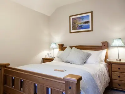 a bedroom with a large bed with two night stands at Parkers House Bed & Breakfast in Newtown