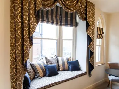 a window seat with pillows sitting in a window at Parkers House Bed & Breakfast in Newtown