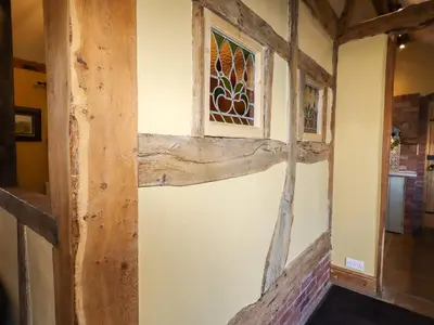 a room with a window and a stairway at The Old Dairy in Shrewsbury