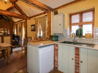 a kitchen with a sink and a counter top at The Old Dairy in Shrewsbury