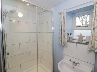 a bathroom with a shower and a sink at The Old Workshop in Church Pulverbatch