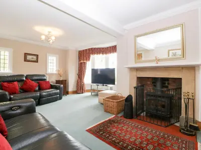 a living room with a couch and a fireplace at The Croft in Vowchurch