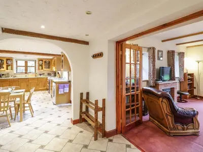 a kitchen and dining room with a table and chairs at The Stable in Craven Arms