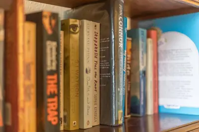 a row of books on a book shelf at Meadow Lea in Leominster