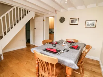 a dining room with a table and chairs at Penlon in Aberystwyth