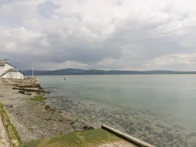 a view of a body of water with a house at Ty Gwyn in Aberdyfi