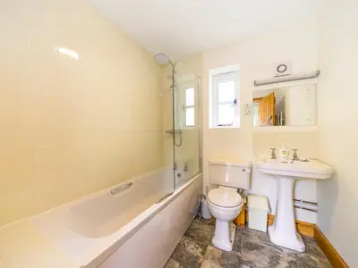 a bathroom with a sink and a toilet and a bath tub at Stone House in Ludlow
