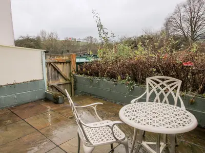 a table and two chairs on a patio at Castle Cottage in Clun