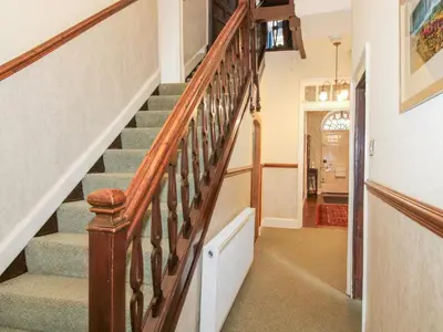 a staircase with wooden railings in a home at The Laurels in Bishops Castle