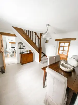 a living room with a wooden table and chairs at Pen Y Bont Cottage Llanuwchllyn Bala in Llanuwchllyn