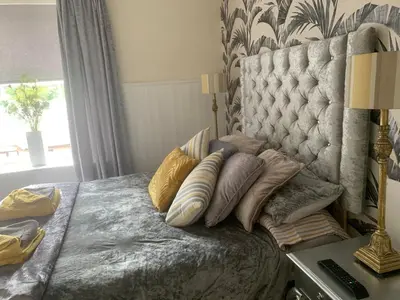 a bedroom with a bed with pillows on it at Peniarth arms in Llanegryn