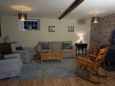 a living room with a couch and a table at Chapel House Cottage in Builth Wells
