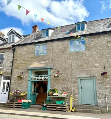 an old brick building with flags in front of it at Number 22, Castle Street in Hay-on-Wye
