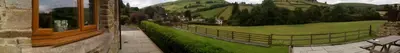 a painting of a park with a fence and grass at Nant-Y-Glyn in Llandrindod Wells