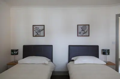 two beds sitting next to each other in a room at Ludlow - Linnet House - Well Presented Townhouse With Parking - Perfect Location For Exploring On Foot, Sleeps Up To 8 Guests - Hosted by RENTMYHOUSE in Ludlow